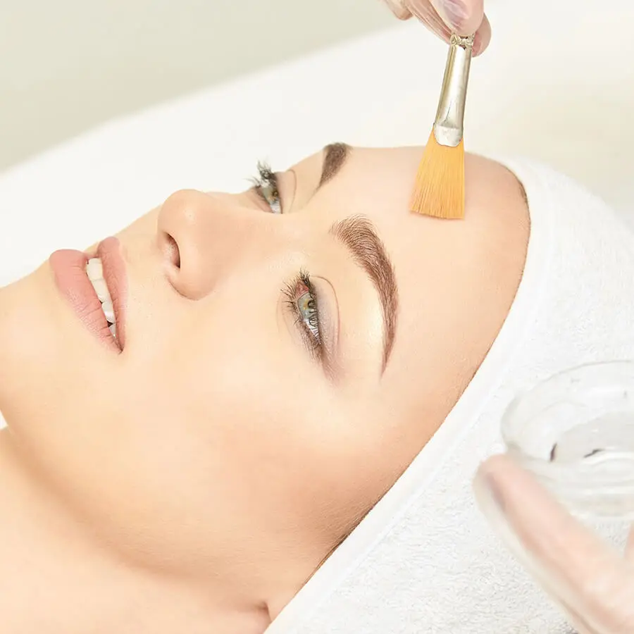 female patient getting facial treatment to her forehead